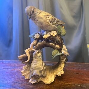 Elegant Bird Figurine with Floral Accents